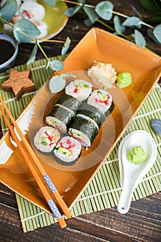 Sushi with salmon and avocado. Sushi roll with salmon and tempura shrimp