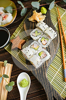 Sushi with salmon and avocado. Sushi roll with salmon and tempura shrimp