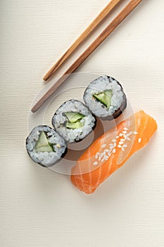 Sushi with salmon and cucumber roll