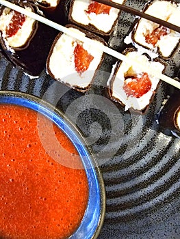 sushi with salmon and sauce