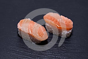 Sushi with salmon on slate