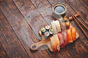 Sushi Set. Different kinds of sushi rolls on wooden serving board