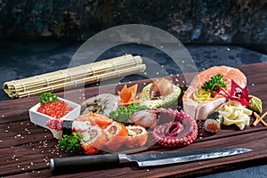 Sushi Set. Different sashimi, sushi and rolls with octopus