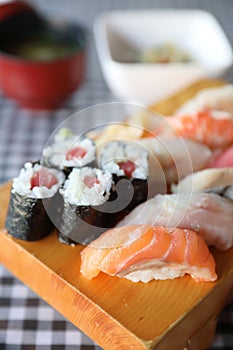 Sushi Set nigiri and sushi maki with tea served , Japanese food