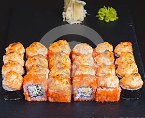 Sushi set. Philadelphia roll, california, unagi, black dragon with fresh ingredients on black background. Sushi menu. Japanese