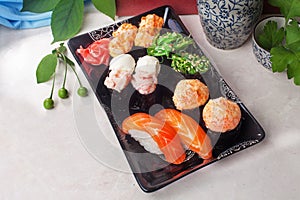 Sushi set on a plate still life, salmon, shrimp, chuka