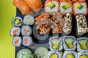 Sushi set restaurant. Black and green background.