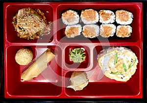 Sushi set with rolls, rice and salad
