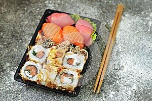 Sushi set with salmon, soft cheese, tuna, smoked eel. Sushi delivery to home. Healthy food. Top view.