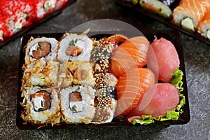 Sushi set with salmon, soft cheese, tuna, smoked eel. Sushi delivery to home. Healthy food. Top view.