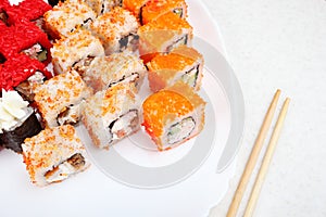 Sushi set on a white plate.