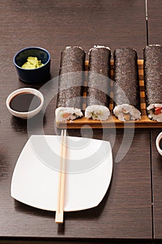 Set of sushi with empty plate on the table