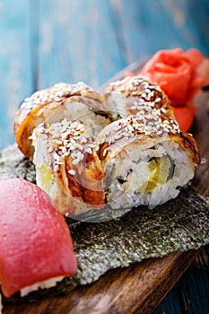 Sushi set on a wooden tray.