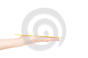 Sushi sticks asian in female hand on a white background photo