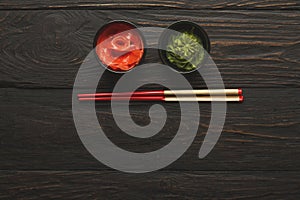 Sushi tablewear top view at dark background photo