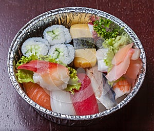 Sushi to go, Nigiri and assorted sushi roll in aluminum foil box