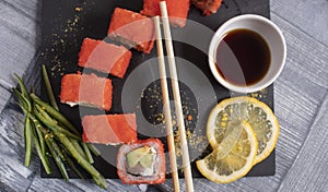 Sushi on torrels, soy, wasabi, ginger and garnish photo