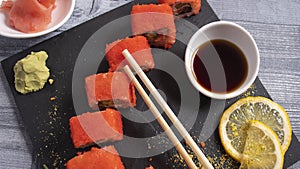 Sushi on torrels, soy, wasabi, ginger and garnish photo