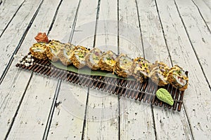 sushi unagi roll in tempura. roll filled with freshwater eel with nori seaweed battered photo