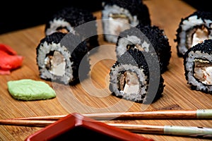 Sushi zuko maki with shrimp, cheese, cucumber and black masago caviar.