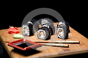 Sushi zuko maki with shrimp, cheese, cucumber and black masago caviar.