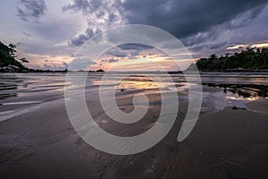 Susnet at Layan beach, lagoon in Phuket, Thailand  during  Low tide