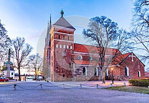 Susnset view of Helga Trefaldighets kyrka and cathedral in Uppsala, Sweden photo