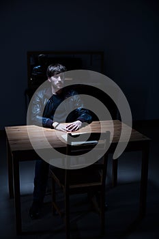 Suspect man in interrogation room
