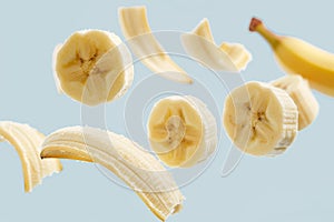 Suspended banana slices dancing elegantly in a pristine white space