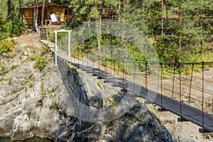 Suspended pedestrian bridge over the river Chemal