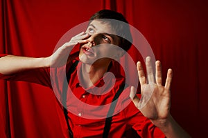 suspenseful man in shirt with suspenders