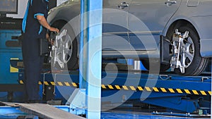 Suspension adjustment and automobile wheel alignment