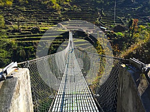 Suspension bridge above the abyss, modern suspension bridge photo shot