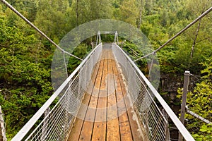 Suspension Bridge above Corrieshalloch Gorge National Reservation photo