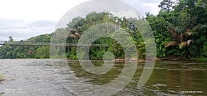 suspension bridge across the Batang Sangir river photo