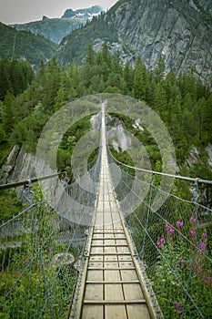 Suspension bridge close to Grimselpass in Swiss Alps
