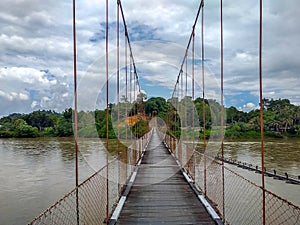 Suspension bridge that crossing Mentarang River, Malinau, outback of Borneo
