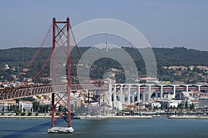 Suspension bridge in Lisbon, Portugal, with cityscape