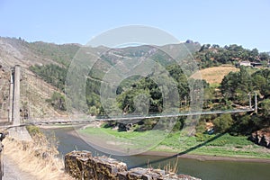 Suspension bridge the Navia river photo