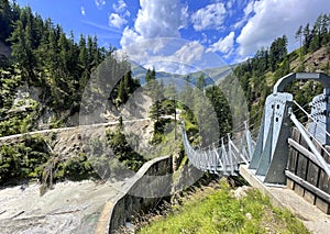 suspension bridge over dam in the Austrian mountains