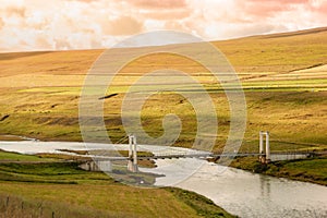 Suspension bridge over the river BlÃ¶nda Blanda in SvÃ­nvetningabraut, in northern Iceland on route F35