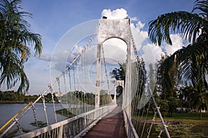 suspension bridge over the river in city park at Udon Thani, Thailand.