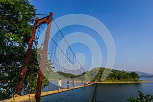 suspension bridge over river at dam