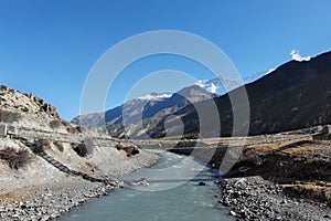 Suspension bridge over the river in the Nepalese Himalayas