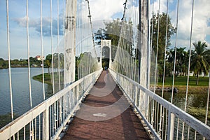 The suspension bridge over the river in Nong Prajak Public Park, Udon Thani