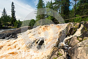 Suspension bridge over Ruskeala waterfalls in Karelia