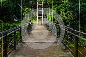 Suspension bridge for pedestrians crossing the River Kwai at Sai Yok National Park