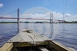 A suspension bridge spanning the Amazon river near Iquitos, Peru photo