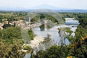 A suspension bridge spanning the river Ardeche photo