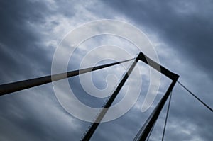 Suspension bridge support brace with background clouds